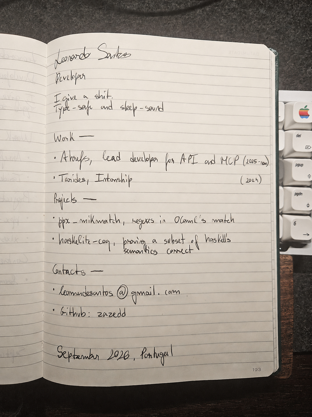 An open notebook displaying my handwritten portfolio.